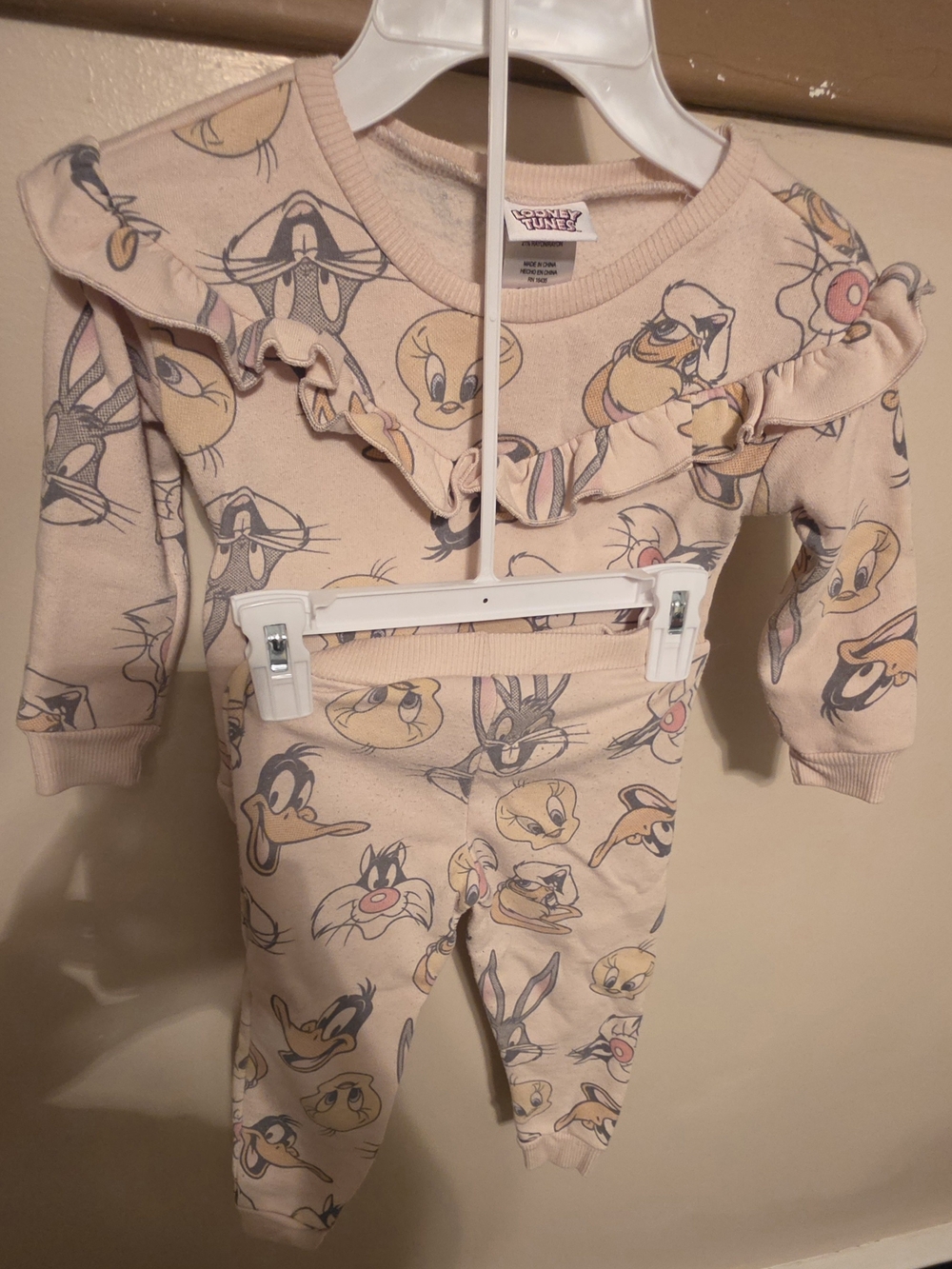 Looney Tunes. Cream Ruffle Toddler One-Piece with Looney Tunes Faces